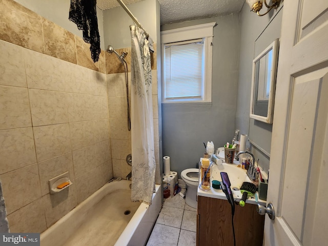 full bathroom with toilet, tile patterned floors, shower / bath combo with shower curtain, vanity, and a textured ceiling