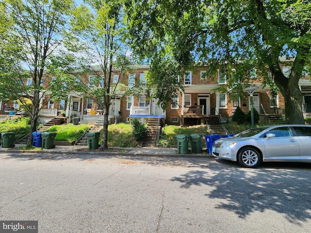 view of property featuring covered porch