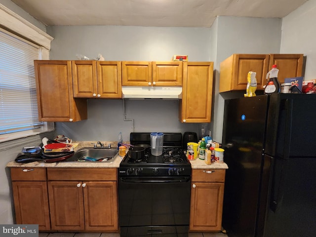 kitchen with black appliances and sink