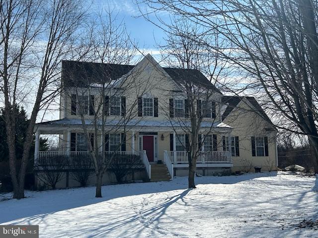 colonial house featuring a porch