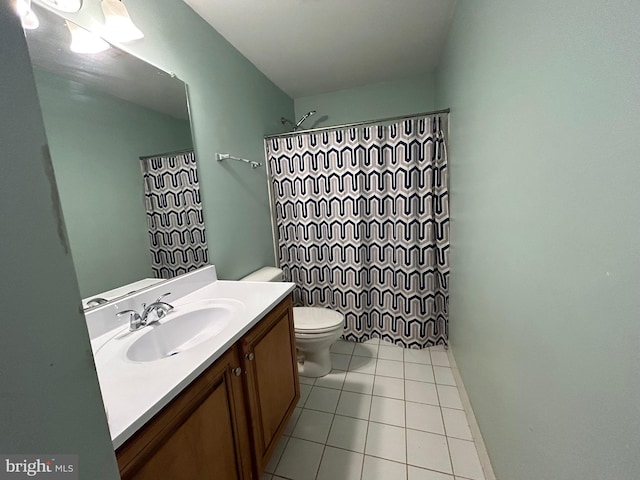 bathroom with walk in shower, tile patterned floors, vanity, and toilet