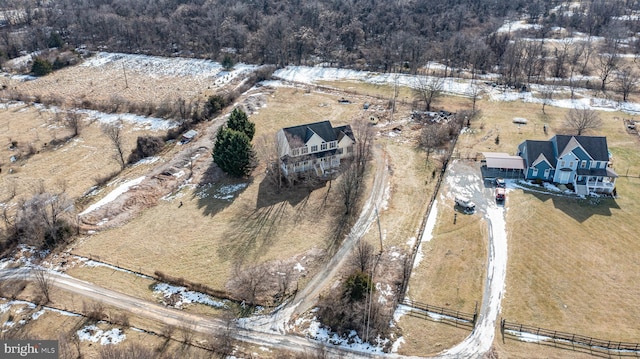 snowy aerial view featuring a rural view