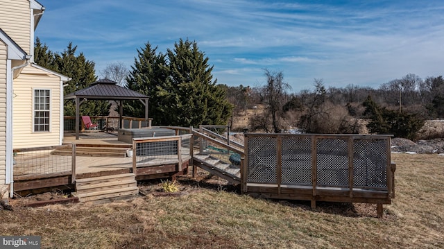 view of yard with a wooden deck and a gazebo