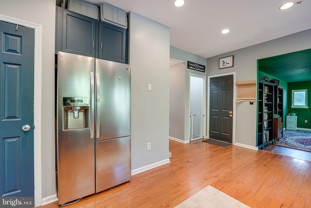 kitchen featuring light hardwood / wood-style floors and stainless steel refrigerator with ice dispenser