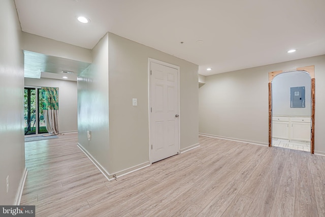 interior space with light hardwood / wood-style flooring and electric panel