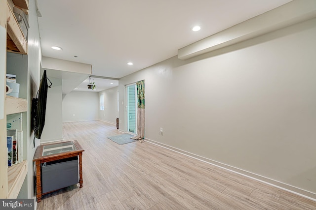 basement featuring light hardwood / wood-style flooring