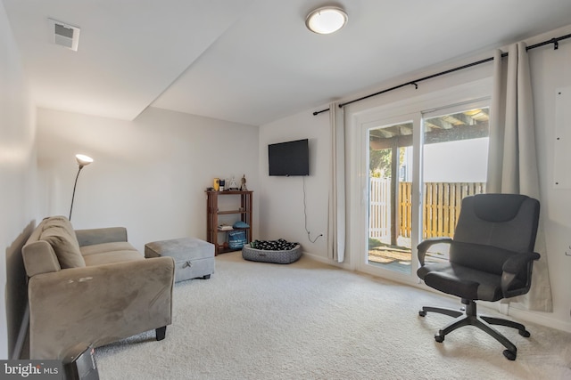 living area featuring carpet flooring