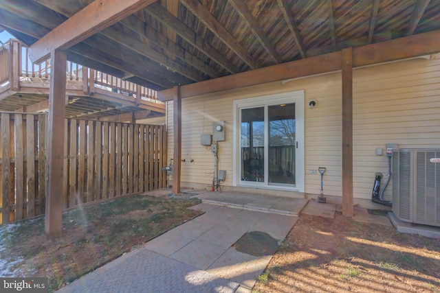 property entrance with a patio and central AC