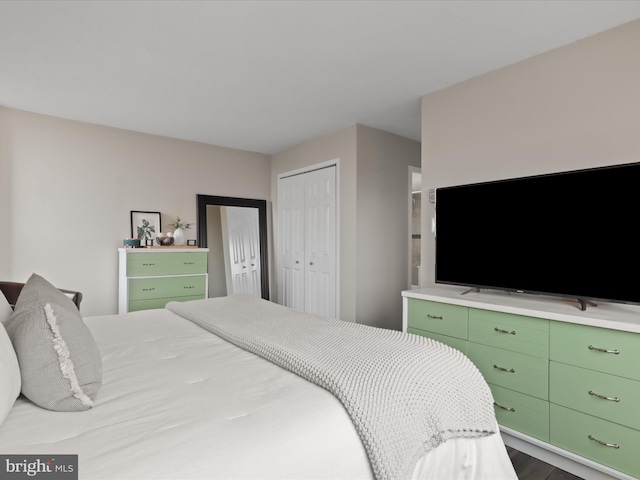 bedroom with a closet and wood finished floors