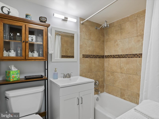 bathroom featuring shower / bath combo, vanity, and toilet