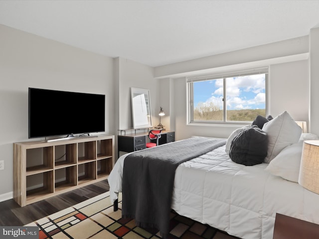 bedroom with wood finished floors