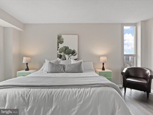 bedroom with wood finished floors