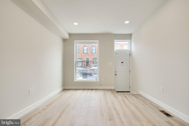 entryway featuring recessed lighting, light wood-type flooring, visible vents, and baseboards