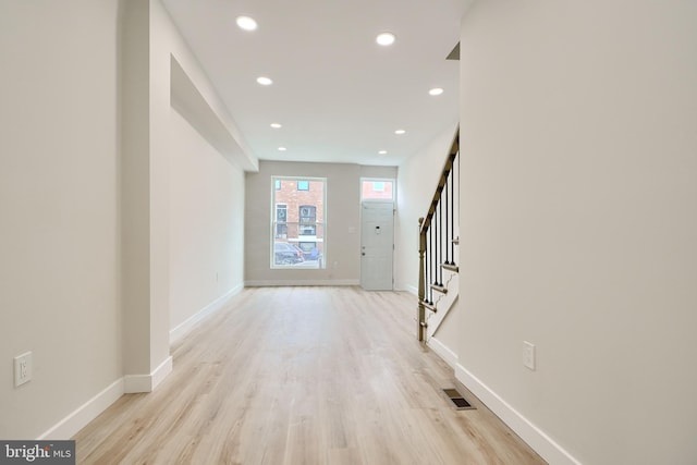 foyer entrance featuring light wood-style flooring, recessed lighting, visible vents, baseboards, and stairs