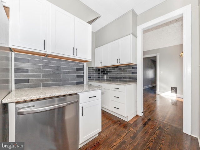 kitchen with white cabinetry, light stone countertops, dark wood-type flooring, and stainless steel dishwasher