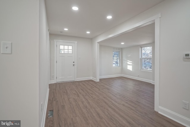 entryway with a healthy amount of sunlight and hardwood / wood-style floors