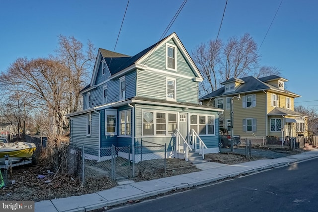 front of property featuring a sunroom