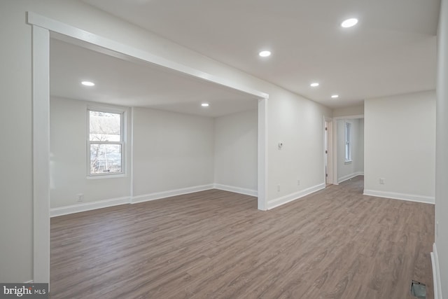 unfurnished room featuring hardwood / wood-style flooring