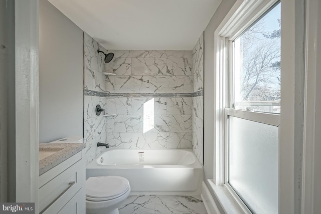 full bathroom with toilet, tiled shower / bath combo, and vanity