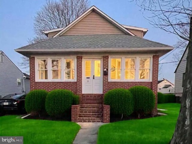 bungalow with a front yard