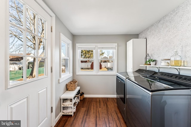 washroom with dark hardwood / wood-style flooring and washer and dryer