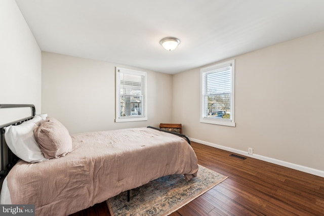 bedroom featuring dark wood-type flooring