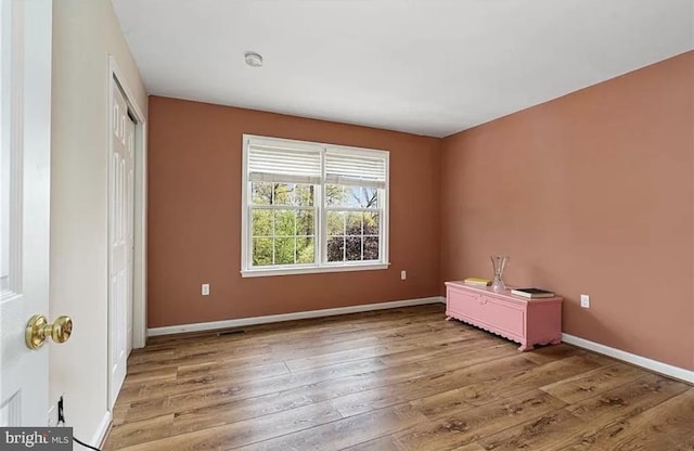 spare room featuring light hardwood / wood-style floors