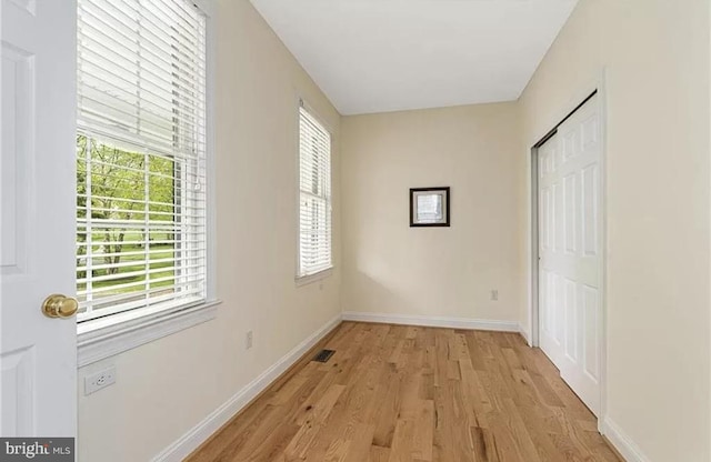 unfurnished bedroom featuring light wood-type flooring