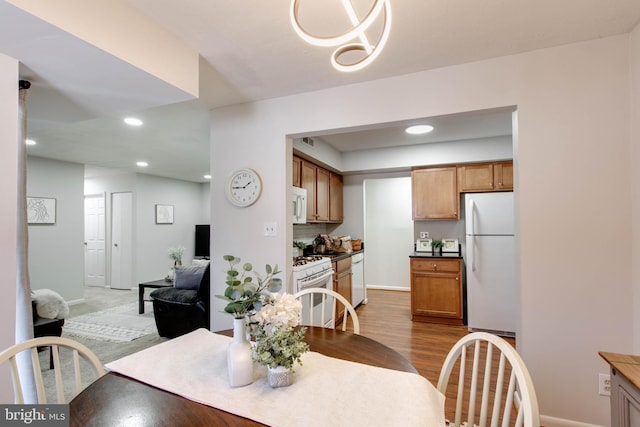 dining area with light hardwood / wood-style flooring