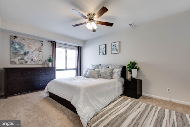 carpeted bedroom featuring ceiling fan