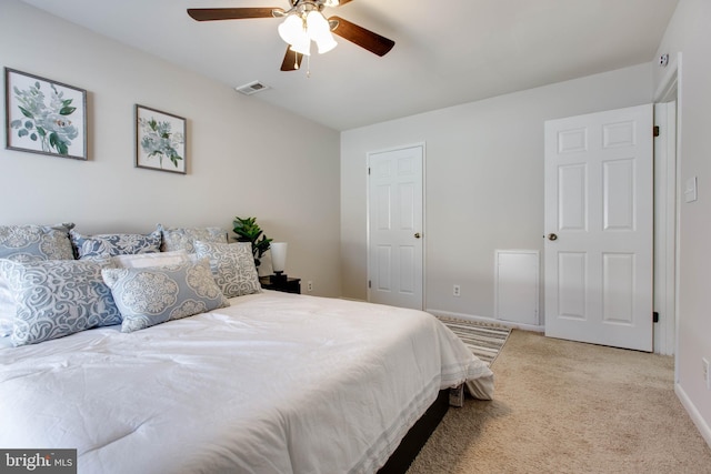 bedroom featuring light carpet and ceiling fan