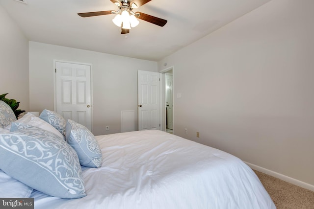 carpeted bedroom with ceiling fan