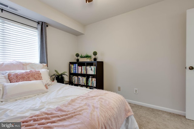 bedroom featuring light colored carpet