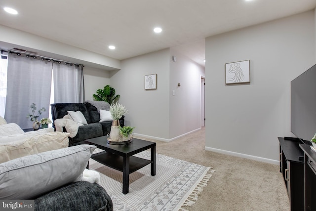 living room featuring light carpet