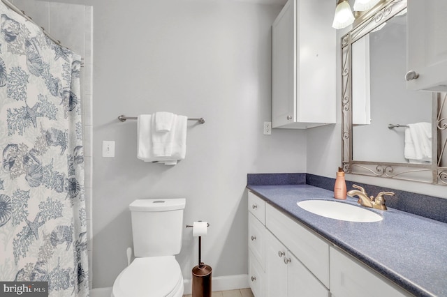 bathroom featuring curtained shower, toilet, and vanity