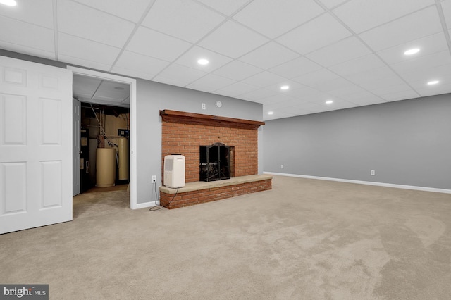 unfurnished living room with light carpet and a brick fireplace