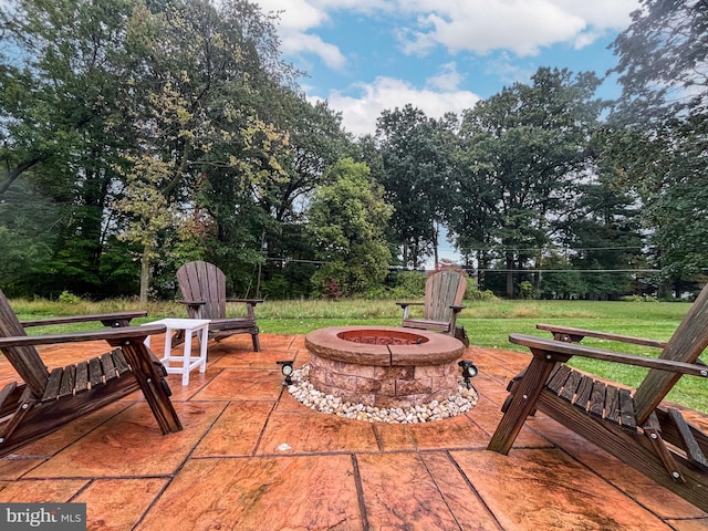 view of patio / terrace with a fire pit