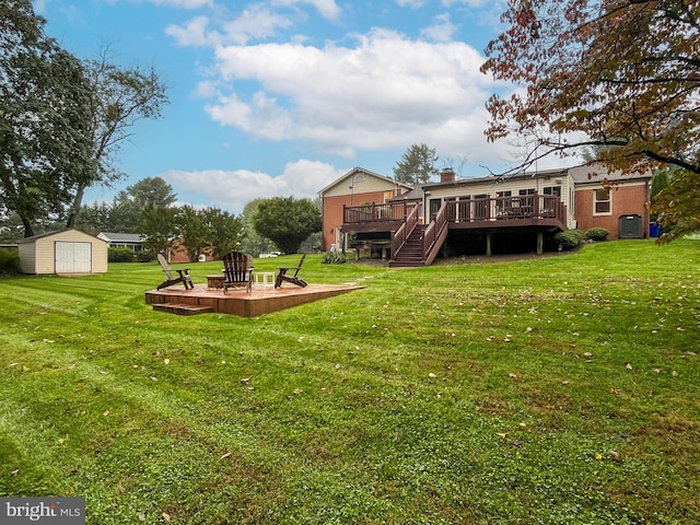 view of yard featuring a deck, central AC unit, and a storage shed