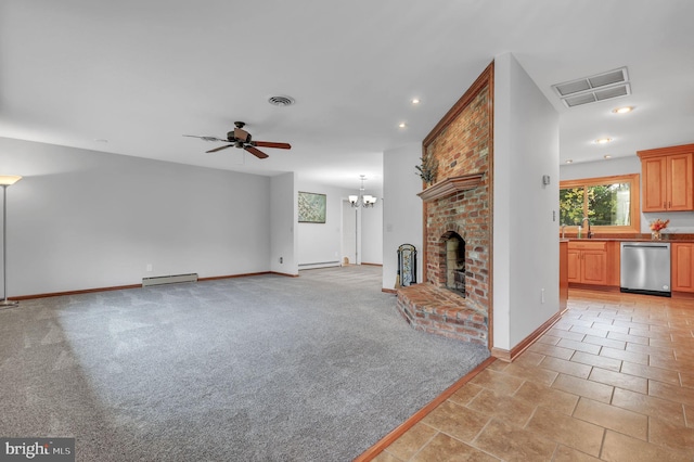 unfurnished living room featuring a fireplace, sink, ceiling fan with notable chandelier, and a baseboard heating unit