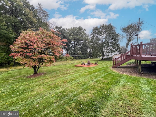 view of yard featuring a wooden deck