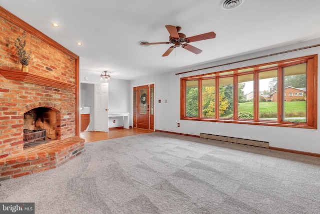 unfurnished living room with ceiling fan, baseboard heating, carpet, and a brick fireplace