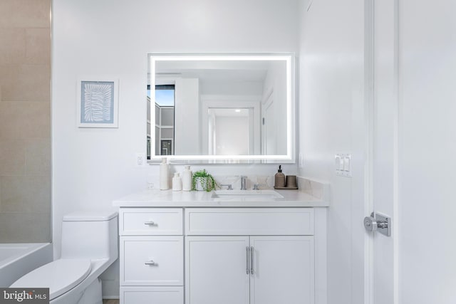 bathroom featuring vanity and toilet