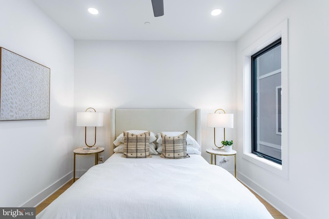 bedroom with ceiling fan and hardwood / wood-style floors