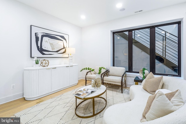 sitting room featuring light hardwood / wood-style flooring