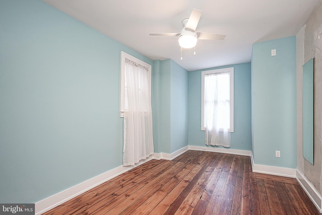 unfurnished room with ceiling fan and wood-type flooring