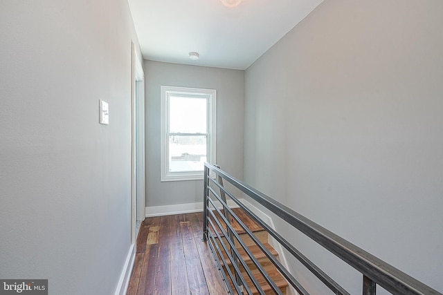 corridor with dark hardwood / wood-style floors