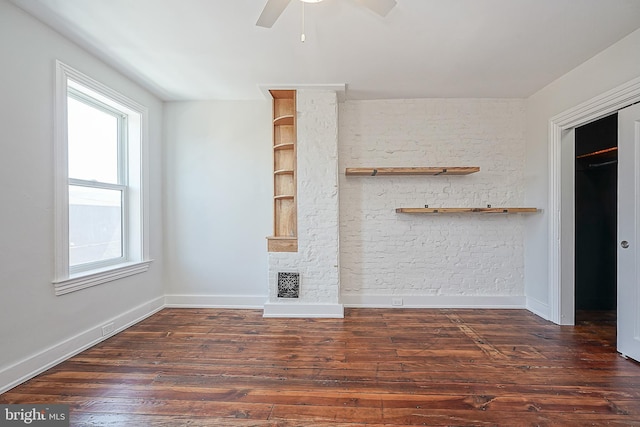 unfurnished living room featuring ceiling fan, dark hardwood / wood-style flooring, and plenty of natural light