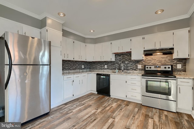 kitchen with white cabinetry, stainless steel appliances, light stone counters, tasteful backsplash, and wood-type flooring