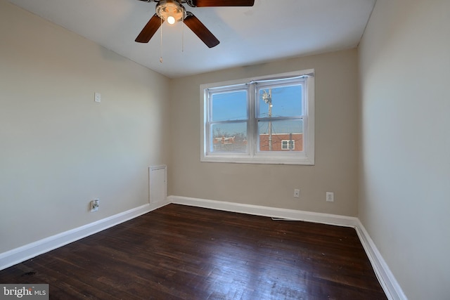 empty room featuring dark hardwood / wood-style floors and ceiling fan