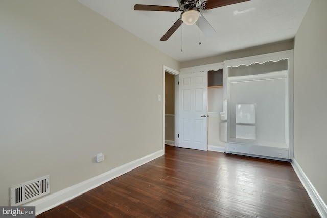 unfurnished bedroom featuring dark hardwood / wood-style floors and ceiling fan